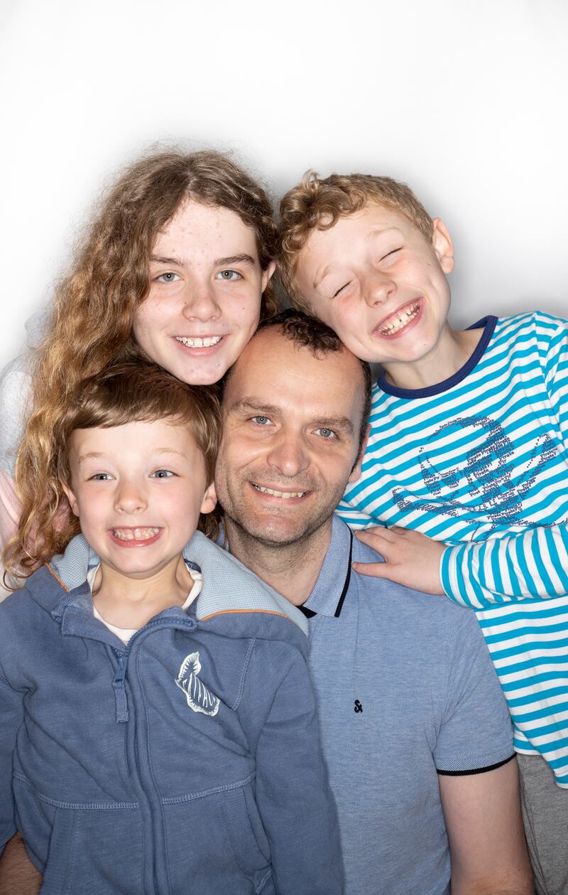 Clive Bowers with his children: 'I’m not going to say I’m a fantastic person or it’s perfectly equal, but you can put on a wash, make a meal, you are not building up all this stuff for Saturday.' Photograph: Tom Honan