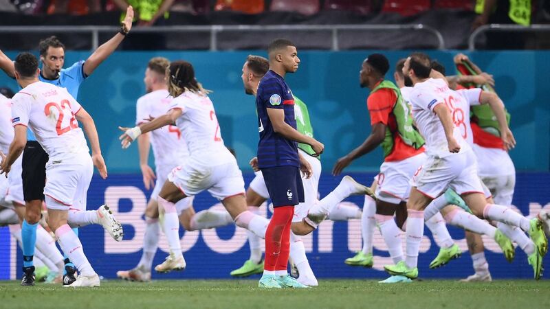 Switzerland celebrate reaching the Euro 2020 quarter-finals after beating France at the National Arena in Bucharest. Photograph: Getty Images