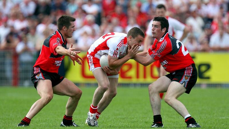 Tyrone’s Tommy McGuigan is  tackled by the Down defence during that famous  Ulster senior championship quarter-final in 2008. Photograph: INPHO/Dan Sheridan