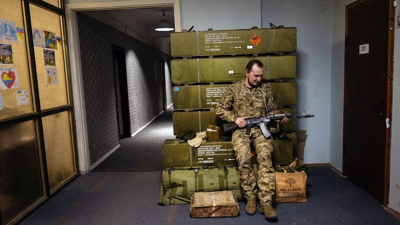 Bizhan Sharopov, a Ukrainian soldier, near a stack of German anti-tank weapons at a military base in Kyiv earlier this month. Photograph: Lynsey Addario/The New York Times