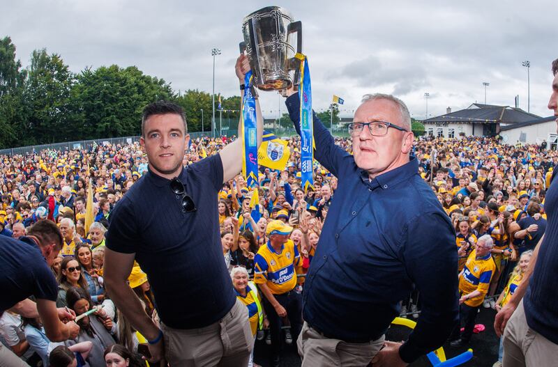 Clare captain Tony Kelly and manager Brian Lohan lift the Liam McCarthy cup at Wolfe Tones club in Shannon. Photograph: Tom Maher/Inpho 