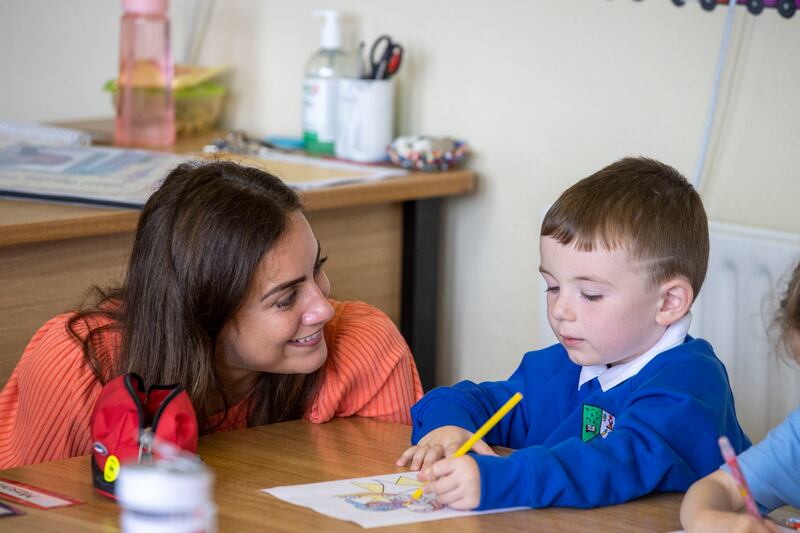Teacher Roisin Regan pictured with junior infant Mason Donlon.
Photograph: Tom Honan