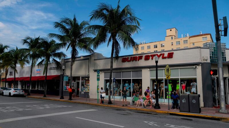 Pedestrians walk along Collins Avenue during a hurricane alert  in South Miami Beach on Thursday. Photograph: Getty Images