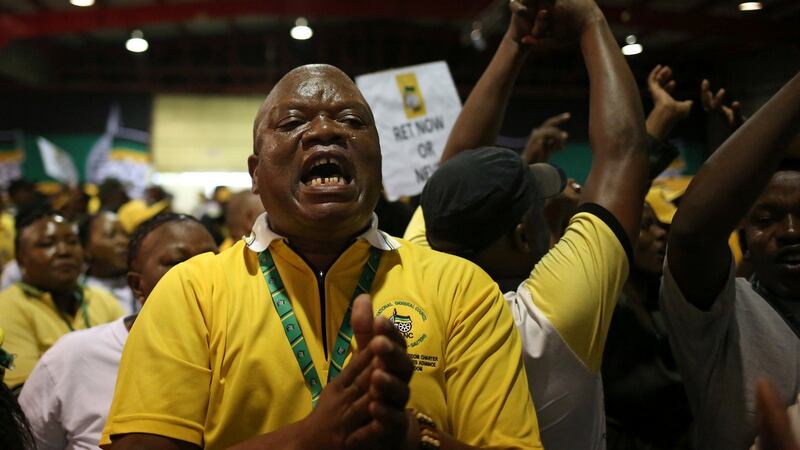 ANC members celebrate after South African deputy president Cyril Ramaphosa was elected president of the ANC, at the Nasrec Expo Centre in Johannesburg. Photograph: Siphiwe Sibeko/Reuters