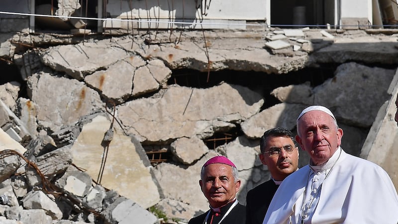 Pope Francis and  the Chaldean Catholic Archbishop of Mosul Najib Mikhael  Moussa (left), near the ruins of the Syriac-Catholic Church of the Immaculate Conception (al-Tahira-l-Kubra), in the old city of  Mosul in March 2021. Photograph:  Vincenzo Pinto/AFP via Getty Images