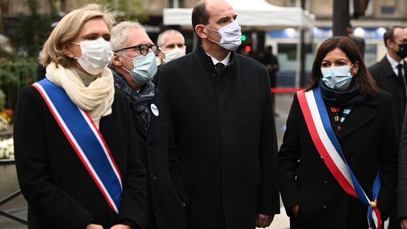 President of French Ile-de-France region Valerie Pecresse, Philippe Duperron, president of the association 13onze15, Fraternite et Verite, which represents the victims of the Paris attacks, French prime minister Jean Castex and Paris mayor Anne Hidalgo pay tribute outside the Bataclan concert venue, in Paris on Friday. Photograph: Christophe Archambault/EPA
