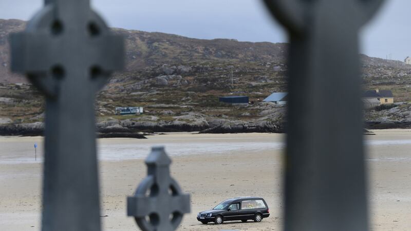 The remains of Pascal Whelan are brought across the sands at low tide to Omey Island in Connemara for burial following funeral mass in nearby Star of the Sea Church in Claddaghduff, Co. Galway in February. 
Photograph: Bryan O'Brien / The Irish Times