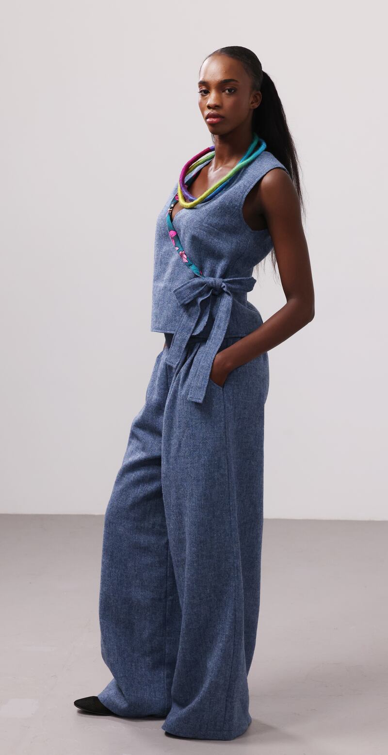 Puff sleeved kimono jacket in Donegal tweed with African print fabric, €464, side tie waistcoat, €280, wide leg trousers, €374, all by Emerald & Wax