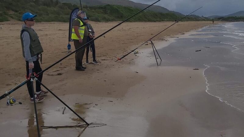 A selection of young anglers fishing on Buncrana beach during the IFI and Foróige Go Fishing programme