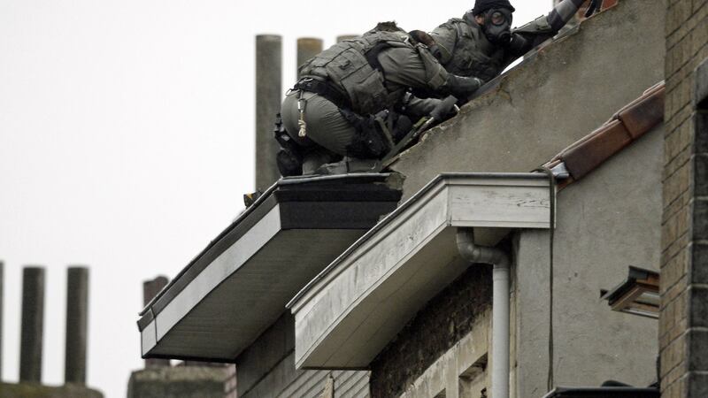 Special-force officers try to enter a house in the Molenbeek district of Brussels on Monday. The transnational aspects of the Paris attacks flag the issue of greater coherence at EU level. Photograph: Dirk Waem/AFP/Getty Images