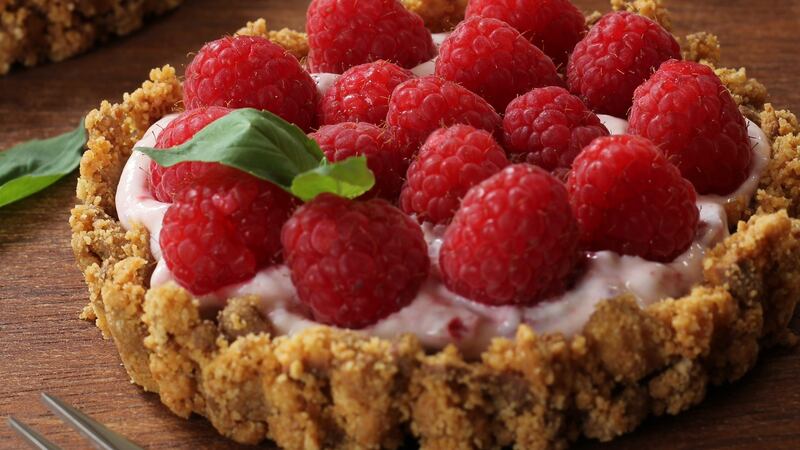 Raspberry cheesecake tarts: garnish with some fresh basil or mint.