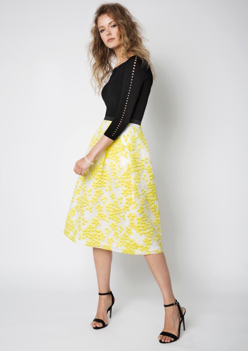 Yellow jacquard skirt (€180) and black knit top (€105) by FeeG