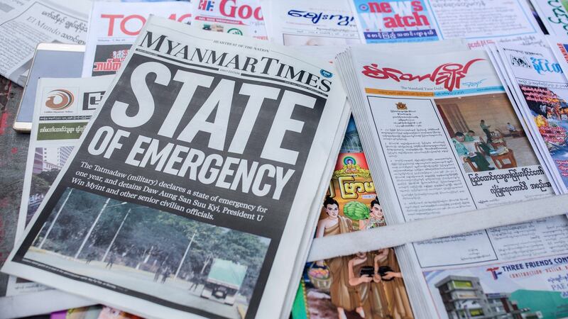 News of the February 2021 military coup in Myanmar newspapers. Photograph: Aung Kyaw Htet/SOPA Images/LightRocket/Getty