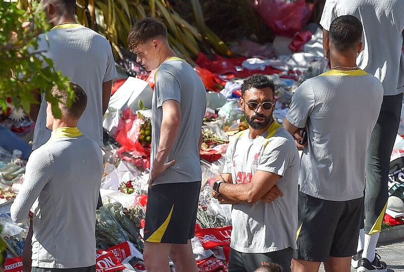 Liverpool player Mohamed Salah and team mates view tributes to late Portuguese soccer player Diogo Jota at Anfield. Photograph: EPA