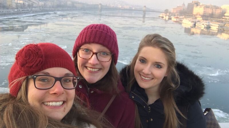 Newly-qualified vets Franziska Kluge from Germany, Delf Jansson and Serena Iceton from Meath on the River Danube in Budapest.