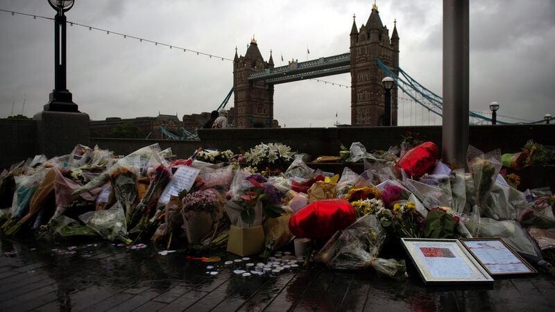Flowers and tributes left outside City Hall, near Tower Bridge for victims of the London Bridge terror attacks. Photograph: Will Oliver/EPA