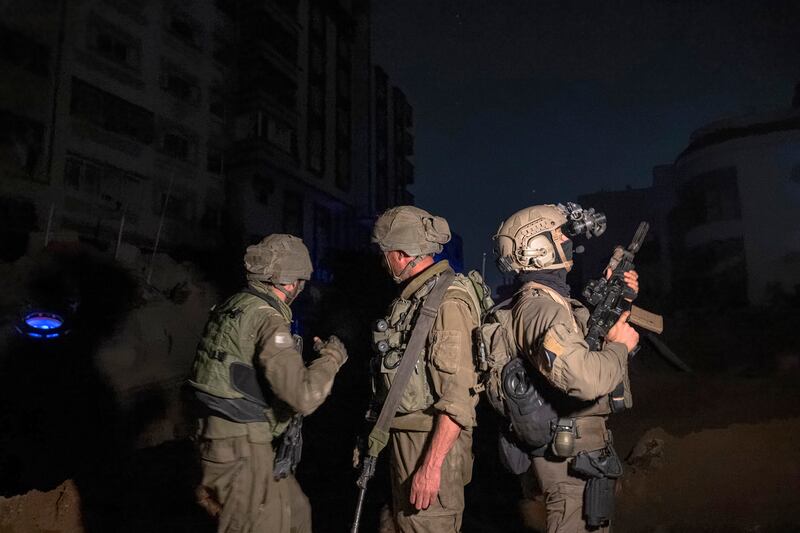 Israeli soldiers on the grounds of Al-Shifa Hospital in Gaza City on November 16th. Photograph: Daniel Berehulak/New York Times
                      