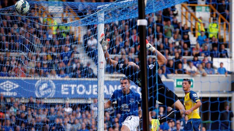 Everton’s Séamus Coleman (left) scores  against Arsenal  at Goodison Park. Photograph: Andrew Yates / Reuters