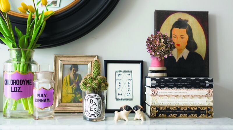 When arranging ornaments, it’s better to work with odd numbers and varying heights. Photograph courtesy of Cathy Pyle. Homeowner: Lisa Mehydene, founder of @edit58