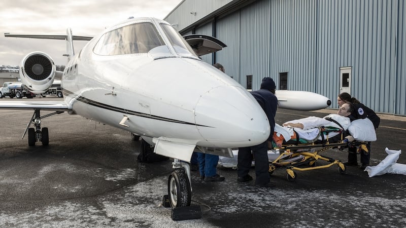 Kevin Babington is loaded onto a jet at the airport in Morristown, New Jersey, after visiting the Kessler Institute for Rehabilitation. Photograph: Bryan Anselm/NYT