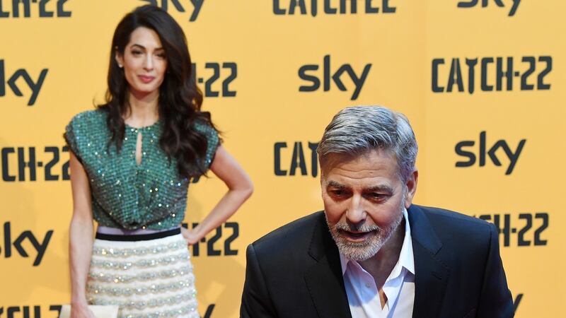 George Clooney with his wife, the human rights lawyer Amal Clooney. Photograph: Getty Images