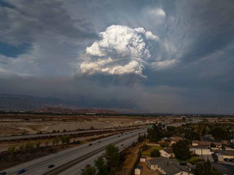 In an aerial view, a massive plume is seen growing over the Line Fire during its 4,000ft elevation climb up to the edge of the mountain community of Running Springs in San Bernadino, California. Photograph: Photograph: David McNew/Getty Images