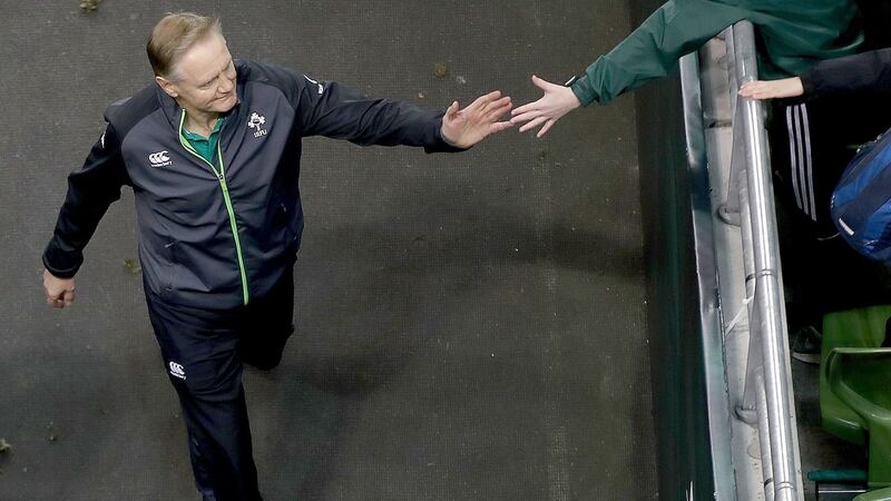 Joe Schmidt high fives a fan before a game against Fiji in 2017.