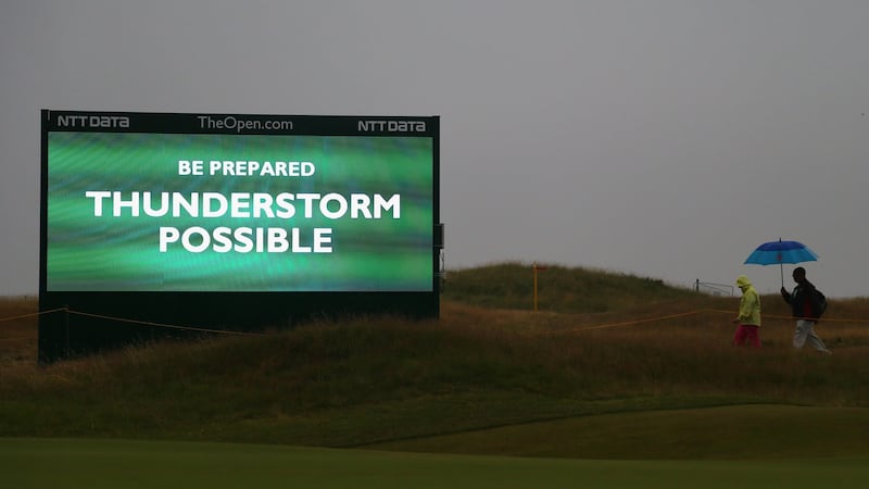 A sign warns of an approaching thunderstorm at the 2014 British Open. Photo: Getty Images