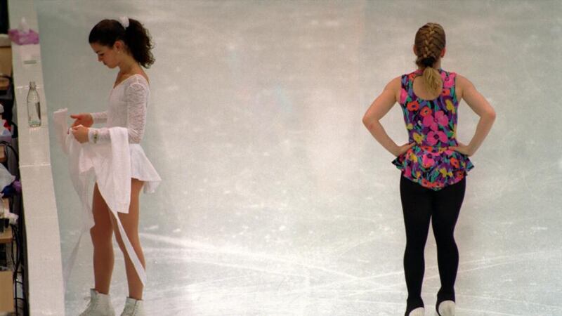 Nancy Kerrigan and Tonya Harding pass each other without notice during a practise session at the 1994 Lillehammer Winter Olympics. Photograph: Pascal Rondeau/Allsport