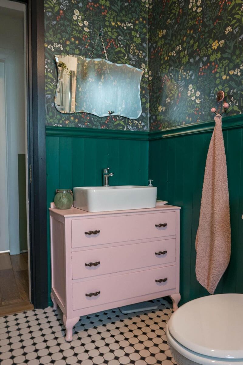The bathroom sink cabinet was made from  an old chest of drawers altered to fit the sink and pipes. Photograph: Keith Heneghan