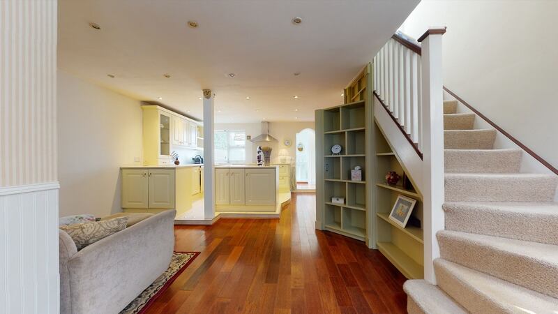 The living room with kitchen in the background.