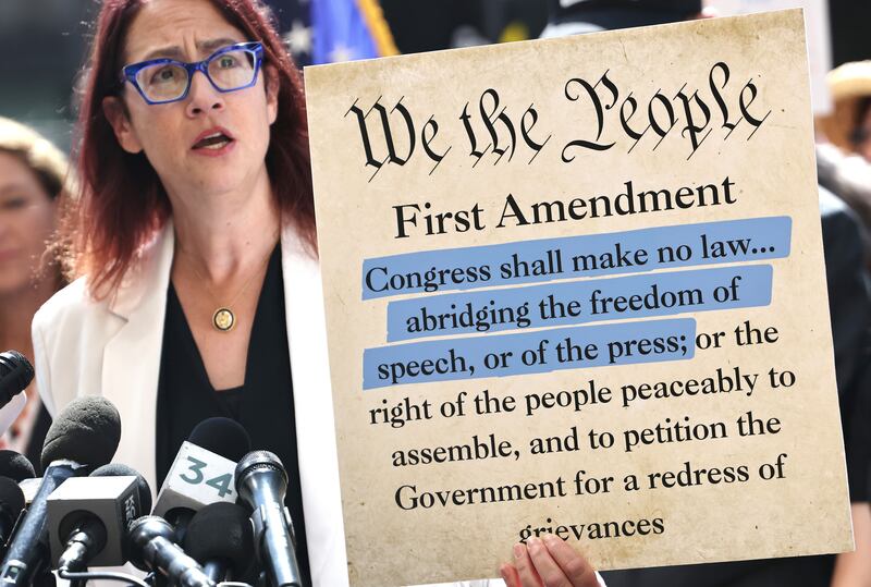 US congresswoman Laura Friedman with a section of the US constituton's first amendment during a protest against the suspension of Jimmy Kimmel. Photograph: Mario Tama/Getty 