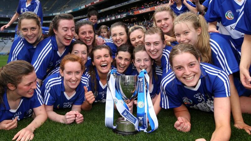 Laois celebrate with the trophy after beating Roscommon. Photograph: Ryan Byrne/Inpho