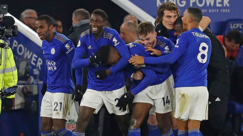 Leicester players celebrate their late winner. Photo: Adrian Dennis/Getty Images
