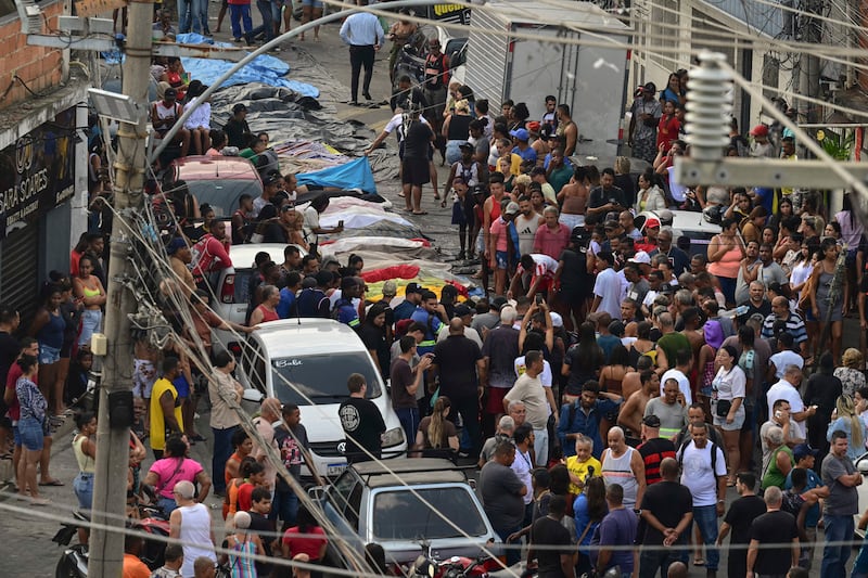 Bodies are seen lined up on Sao Lucas Square of the Vila Cruzeiro favela at the Penha complex in Rio de Janeiro, Brazil, on October 29, 2025, in the aftermath of Operacao Contencao (Operation Containment). Photograph: Pablo Porciuncula/Getty Images    