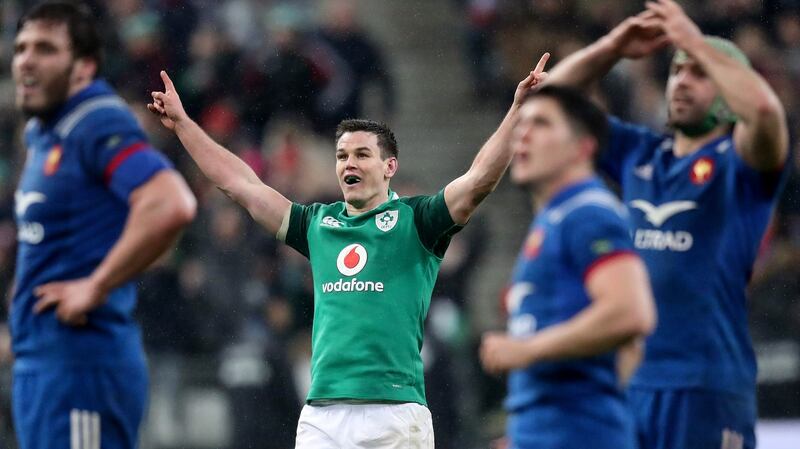 Johnny Sexton celebrates kicking a drop goal to win the game.