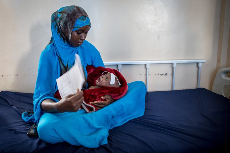 Farhiya Mayow Muhiyadin cares for her nephew, Ahmed, who is eight months old and weighs 3.7kg. Photograph: Sally Hayden.