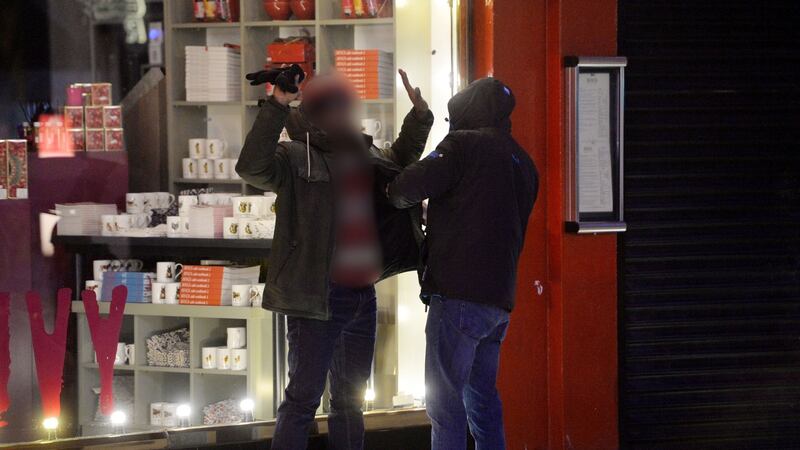 Undercover gardaí  searching  a rickshaw driver on Dublin’s Suffolk Street after observing a drug deal. Photograph: Alan Betson