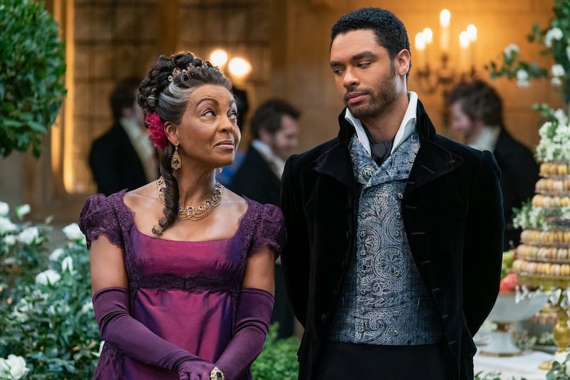Adjoa Andoh and Regé-Jean Page confer in an episode of the Netflix series Bridgerton. Photograph: Liam Daniel/Netflix