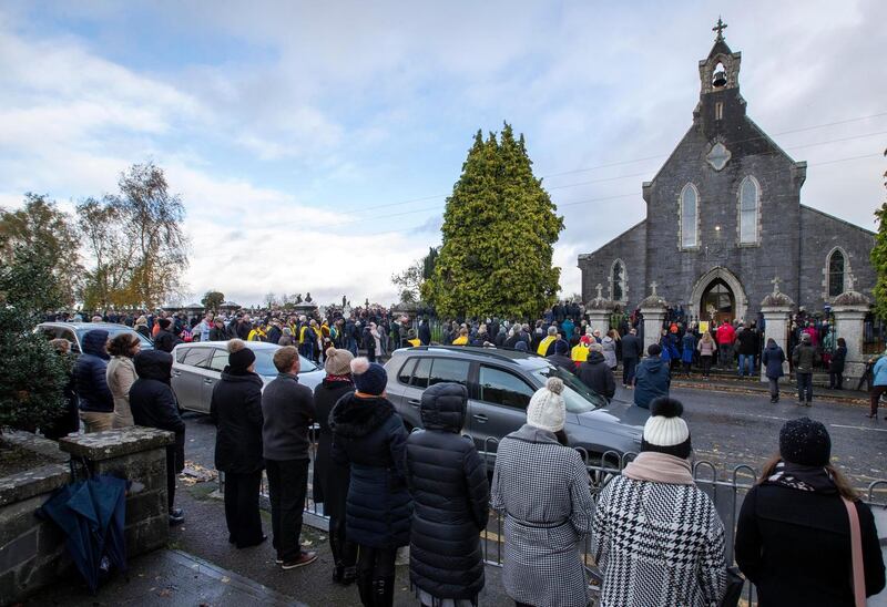 Locals, friends and mourners line the street  at the funeral mass on Friday. Photograph: Colin Keegan/Collins Dublin