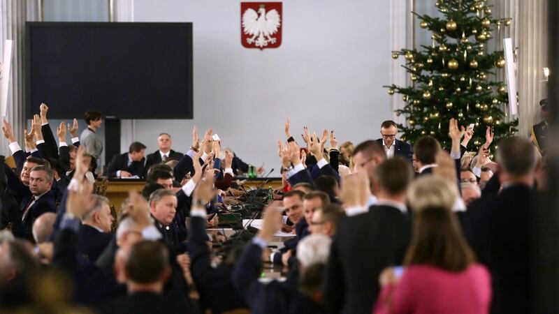 Governing party Law and Justice (PiS) parliamentarians during the session of Polish parliament at the Column Hall of the Sejm. Photograph: Tomasz Gzell/EPA