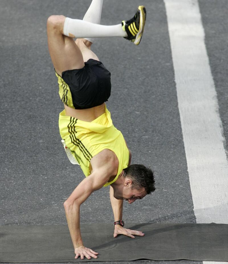 Thomas Bedford, from London, cartwheels over the line at the 2009 marathon. Photograph: Dara Mac Dónaill