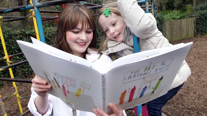 Children’s Books Ireland Book Doctor Kim Harte with three-year-old Nahla Burke.  Photograph: Mark Stedman/Photocall Ireland