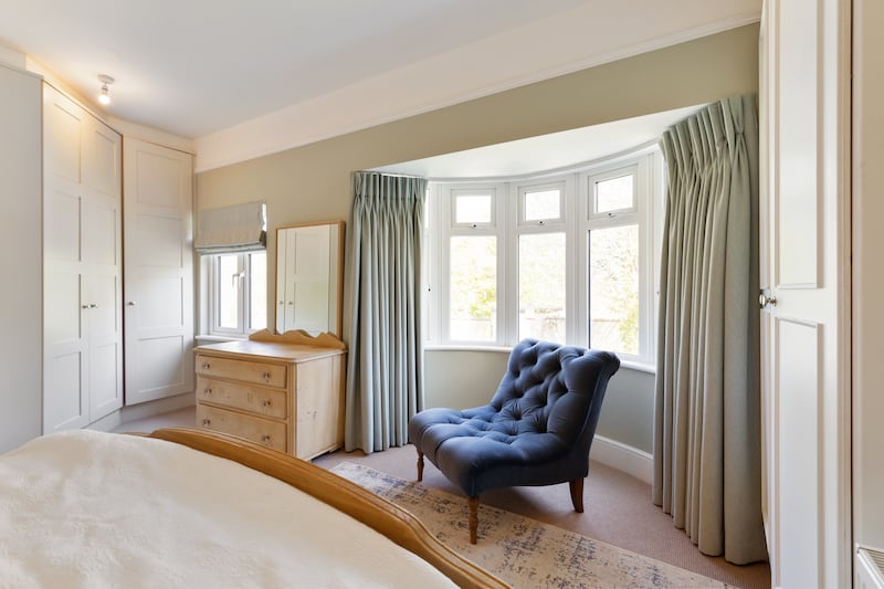 Main bedroom takes up the width of the house and has a bay window