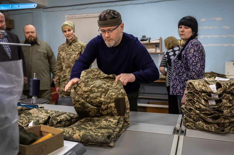 Oleksandr Vilkul inspects uniforms at a military clothing factory in May 2022 in Kryvyi Rih. Photograph: John Moore/Getty Images