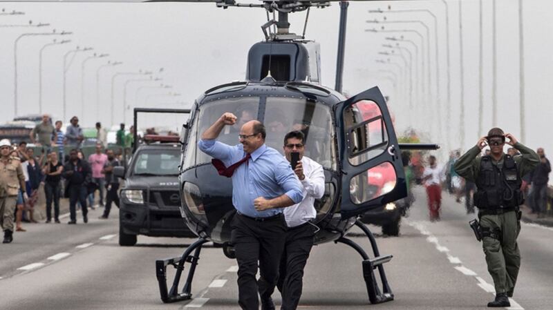 Rio de Janeiro governor Wilson Witzel  celebrates after a police sniper killed a man who took 37 people hostage on a bus in the Brazilian city on Tuesday. Photograph: Antonio Lacerda/EPA