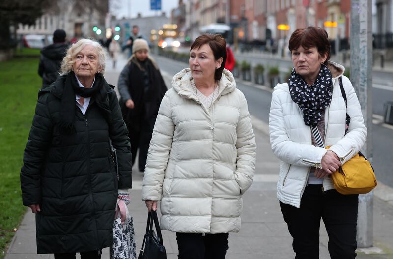 Gertrude Barrett, mother of Stardust victim Michael Barrett, and her daughter Carol (right) with Susan Behan (centre), sister of victim John Colgan, at the Stardust inquest in Dublin. Photograph: Dara Mac Dónaill








