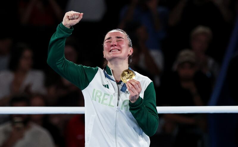 Kellie Harrington celebrates on the podium with her gold medal. Photograph: Ryan Byrne/Inpho