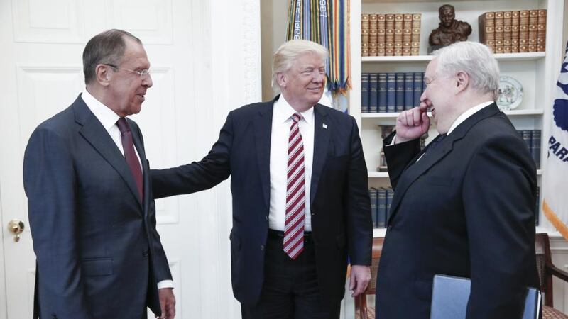 Oval Office meeting: Russia’s foreign minister, Sergei Lavrov, President Trump, and Russian ambassador to the United States Sergei Kislyak at the White House. Photograph: Alexander Shcherbak/Tass via Getty