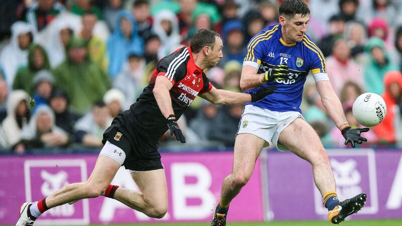 Mayo’s Keith Higgins trying to keep tabs on Kerry’s Paul Geaney. Photograph: Gary Carr/Inpho